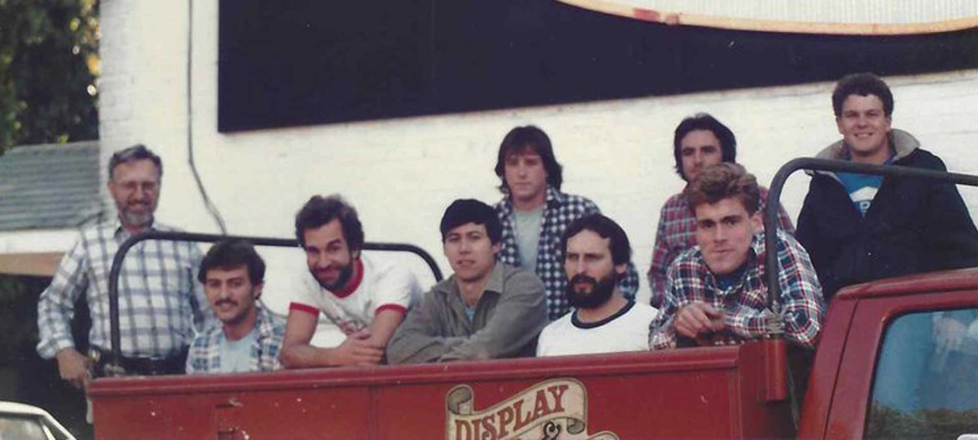 A group of men sitting in a truck